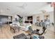 Spacious living area with a modern open floor plan, connecting kitchen, and dining area at 527 Serenity Point Dr, Henderson, NV 89012
