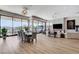 An open concept living and dining space with large windows offering ample natural light at 527 Serenity Point Dr, Henderson, NV 89012
