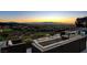 Outdoor patio with comfortable seating, a modern fire feature, and amazing sunset views at 527 Serenity Point Dr, Henderson, NV 89012