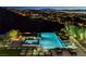 Luxury pool and spa area offer stunning city views, creating a serene and inviting outdoor space for relaxation at 527 Serenity Point Dr, Henderson, NV 89012