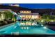 Gorgeous pool with a view of the modern home in the background, ideal for relaxation at 527 Serenity Point Dr, Henderson, NV 89012