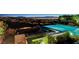 Enjoy breathtaking city views from the pool area with a fire feature and ample seating for relaxation and entertainment at 527 Serenity Point Dr, Henderson, NV 89012
