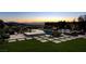 Inviting backyard with an infinity pool, lounge chairs, and beautiful sunset views at 527 Serenity Point Dr, Henderson, NV 89012