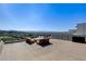 Expansive rooftop patio featuring modern furniture with amazing golf course and city views at 527 Serenity Point Dr, Henderson, NV 89012