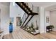 View of the staircase with wood and steel accents, plus a creative plant display that enhances the home's interior design at 527 Serenity Point Dr, Henderson, NV 89012