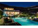 A modern home featuring a sparkling pool, spa, and expansive backyard, perfect for outdoor entertaining at 527 Serenity Point Dr, Henderson, NV 89012