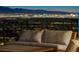 Balcony featuring comfortable seating and stunning city views, ideal for relaxing and entertaining guests outdoors at 527 Serenity Point Dr, Henderson, NV 89012
