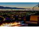 Breathtaking views of the city skyline, perfect for enjoying a relaxing evening by the fire pit at 527 Serenity Point Dr, Henderson, NV 89012