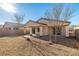 A spacious backyard featuring desert landscaping and views of the surrounding neighborhood at 5338 Lignum Ave, Pahrump, NV 89061