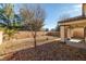 Backyard with gravel, block wall and covered patio at 5338 Lignum Ave, Pahrump, NV 89061
