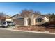 Charming single-story home featuring a low-maintenance desert landscaped front yard and a two-car garage at 5338 Lignum Ave, Pahrump, NV 89061