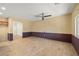 Open-concept living room with tile floors and neutral paint, offering versatile design possibilities at 5338 Lignum Ave, Pahrump, NV 89061