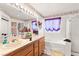 Bright bathroom with double sink vanity, large mirror and separate tub and shower at 5539 Foxtail Ridge St, North Las Vegas, NV 89031