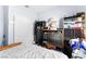 Bedroom featuring a bed, closet, and multiple dark colored cabinets with storage space at 5539 Foxtail Ridge St, North Las Vegas, NV 89031
