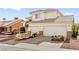 Exterior view of two-story home with three-car garage and desert landscaping at 5539 Foxtail Ridge St, North Las Vegas, NV 89031