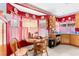 Cozy kitchen with red walls, breakfast table, and ample cabinet space at 5539 Foxtail Ridge St, North Las Vegas, NV 89031