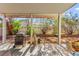 A covered patio with a BBQ grill and well-maintained backyard, ideal for outdoor relaxation and entertaining at 5539 Foxtail Ridge St, North Las Vegas, NV 89031