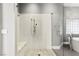 Elegant glass shower adjacent to soaking tub, enhanced by natural light and modern fixtures at 5680 N Fort Apache Rd, Las Vegas, NV 89149