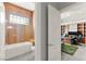 Modern bathroom with a glass-door shower, stone bench and view to the office at 5680 N Fort Apache Rd, Las Vegas, NV 89149