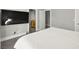 Bright bedroom offers an open doorway and gray floors at 5680 N Fort Apache Rd, Las Vegas, NV 89149