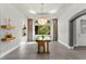 Elegant dining room showcases a modern chandelier and a glass-topped table under bright lighting at 5680 N Fort Apache Rd, Las Vegas, NV 89149
