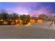 Charming single-story home with a desert landscape, three-car garage, and solar panels at 5680 N Fort Apache Rd, Las Vegas, NV 89149