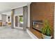 A cozy fireplace with unique tile surround and access to backyard at 5680 N Fort Apache Rd, Las Vegas, NV 89149