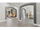 Spacious foyer showcases arched doorways and modern tile flooring, offering an elegant entrance at 5680 N Fort Apache Rd, Las Vegas, NV 89149