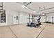 Spacious garage with storage cabinets and exercise equipment at 5680 N Fort Apache Rd, Las Vegas, NV 89149