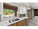 Kitchen sink featuring a view of the backyard and pool at 5680 N Fort Apache Rd, Las Vegas, NV 89149
