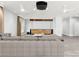 Living room features a large projection screen, modern furnishings, and a neutral color palette at 5680 N Fort Apache Rd, Las Vegas, NV 89149
