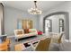 Modern living room featuring stylish furniture, artistic decor, and ample natural light at 5680 N Fort Apache Rd, Las Vegas, NV 89149