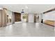 Spacious living room with fireplace, built-in cabinetry, and large windows at 5680 N Fort Apache Rd, Las Vegas, NV 89149