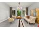Bright living room features modern furnishings, a decorative screen, and large windows for natural light at 5680 N Fort Apache Rd, Las Vegas, NV 89149