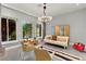Bright living room features modern furnishings, a decorative screen, and large windows for natural light at 5680 N Fort Apache Rd, Las Vegas, NV 89149