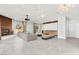 Spacious living room features a brick fireplace, projection screen, and comfortable, modern furniture arrangement at 5680 N Fort Apache Rd, Las Vegas, NV 89149