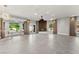 Expansive living room featuring a fireplace, large windows, and neutral decor at 5680 N Fort Apache Rd, Las Vegas, NV 89149