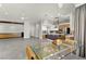 Expansive open living space with a modern kitchen, dining area, and ample room for entertaining at 5680 N Fort Apache Rd, Las Vegas, NV 89149