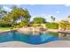 Gorgeous pool with lush landscaping and a relaxing spa at 5680 N Fort Apache Rd, Las Vegas, NV 89149
