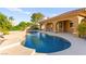 Inviting pool with stone accents and a covered patio at 5680 N Fort Apache Rd, Las Vegas, NV 89149
