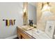 Stylish powder room with unique vessel sink, decorative lighting, and marble accents at 5680 N Fort Apache Rd, Las Vegas, NV 89149
