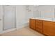 Bathroom features tile flooring, a double vanity, and a glass-enclosed shower for a modern feel at 6041 Rosanna St, Las Vegas, NV 89113