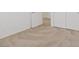 A light carpeted bedroom featuring white walls and an open door at 6041 Rosanna St, Las Vegas, NV 89113