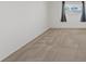 Bedroom with neutral carpet and a window featuring curtains for privacy at 6041 Rosanna St, Las Vegas, NV 89113