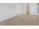 Bedroom features neutral carpet and an open layout with natural light at 6041 Rosanna St, Las Vegas, NV 89113