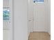 Bright entryway features a white front door, tiled flooring, and a view of the living area with natural light at 6041 Rosanna St, Las Vegas, NV 89113