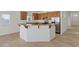 A kitchen with brown cabinets, stainless steel appliances, and a granite breakfast bar at 6041 Rosanna St, Las Vegas, NV 89113