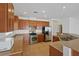 Spacious kitchen with stainless appliances, granite countertops and tile flooring at 6041 Rosanna St, Las Vegas, NV 89113