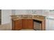 Kitchen featuring stainless steel appliances, wood cabinetry, and granite countertops at 6041 Rosanna St, Las Vegas, NV 89113