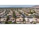 Expansive aerial view of a residential neighborhood with well-maintained homes and picturesque mountain backdrop at 6209 Lenaking Ave, Las Vegas, NV 89122